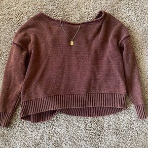 Very cute brown sweater with a cut out back and tie at the neck!